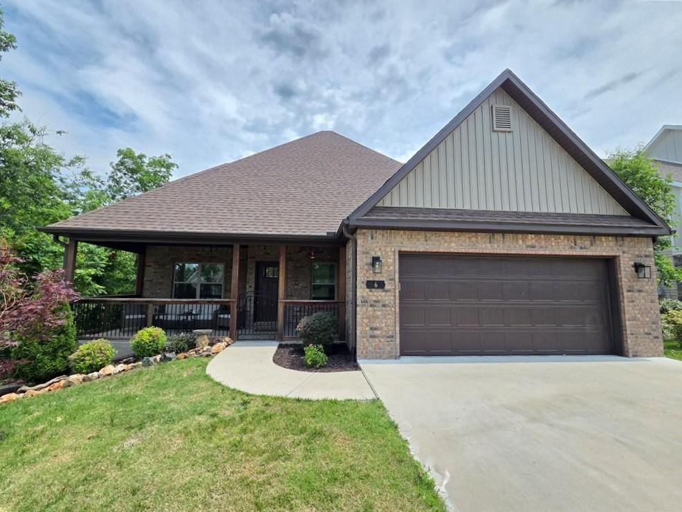 Image 1: Welcoming front with covered front porch