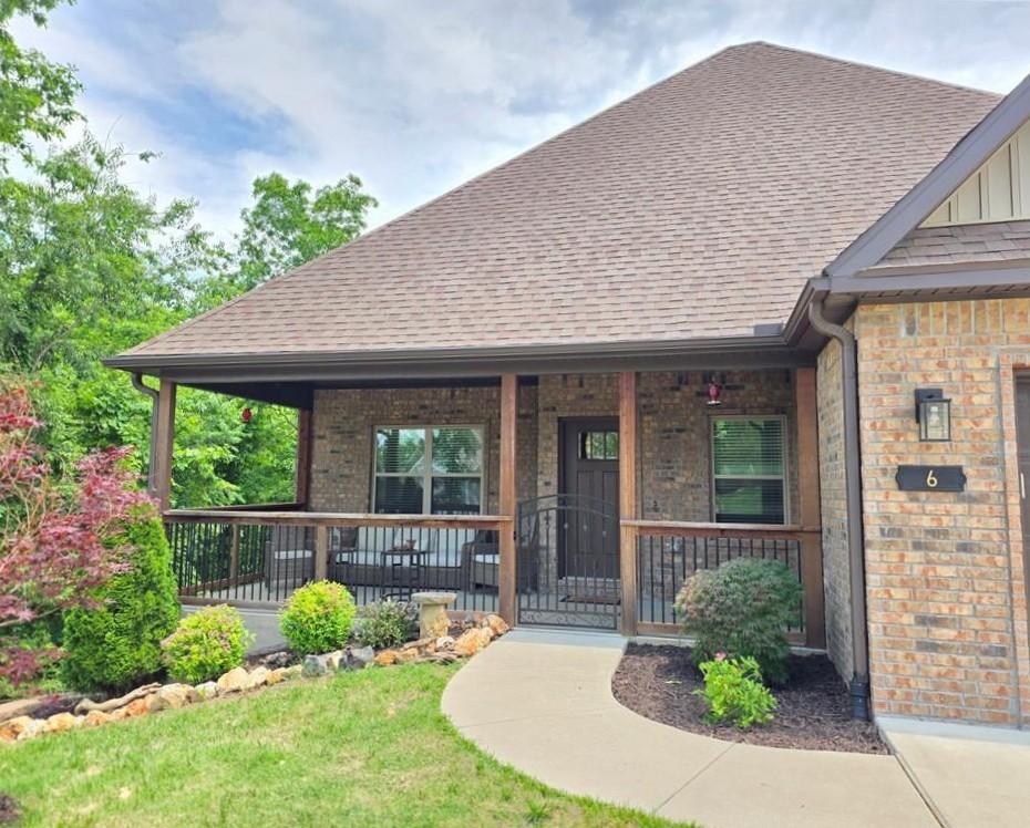 Image 2: Covered front porch featuring wood support columns