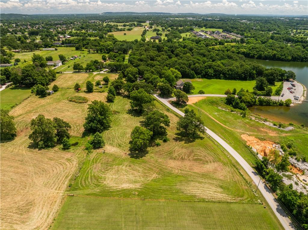 Image 1: Expansive acreage featuring a mix of cleared land