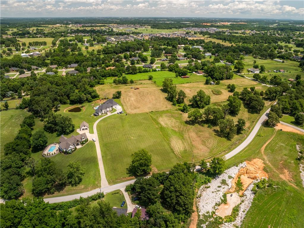Image 3: Expansive property featuring a private paved drive