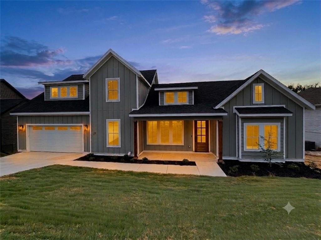 Image 1: Modern farmhouse exterior with vertical siding, do