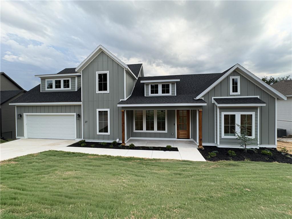 Image 3: Contemporary farmhouse-style exterior featuring ve