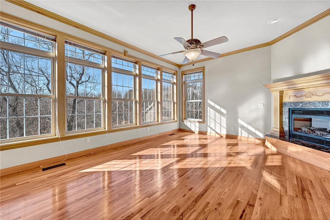 Image 4: Unfurnished living room featuring crown molding, l