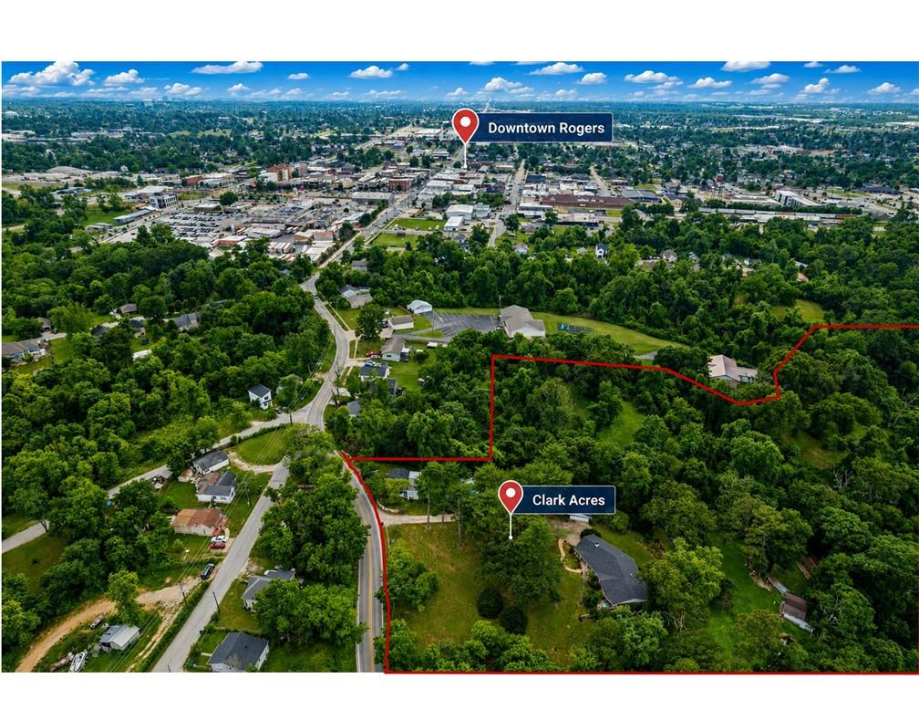 Image 2: Expansive undeveloped land parcel featuring mature
