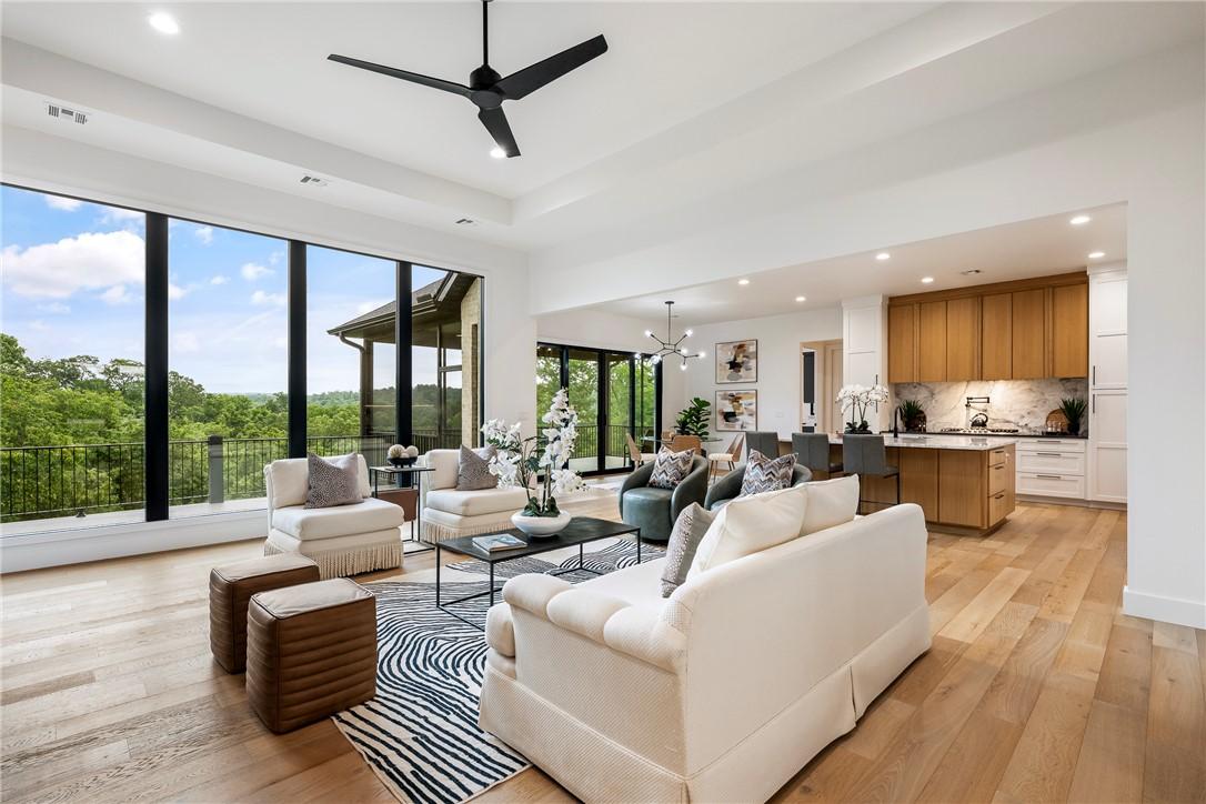 Image 4: Open-concept living space featuring expansive floo
