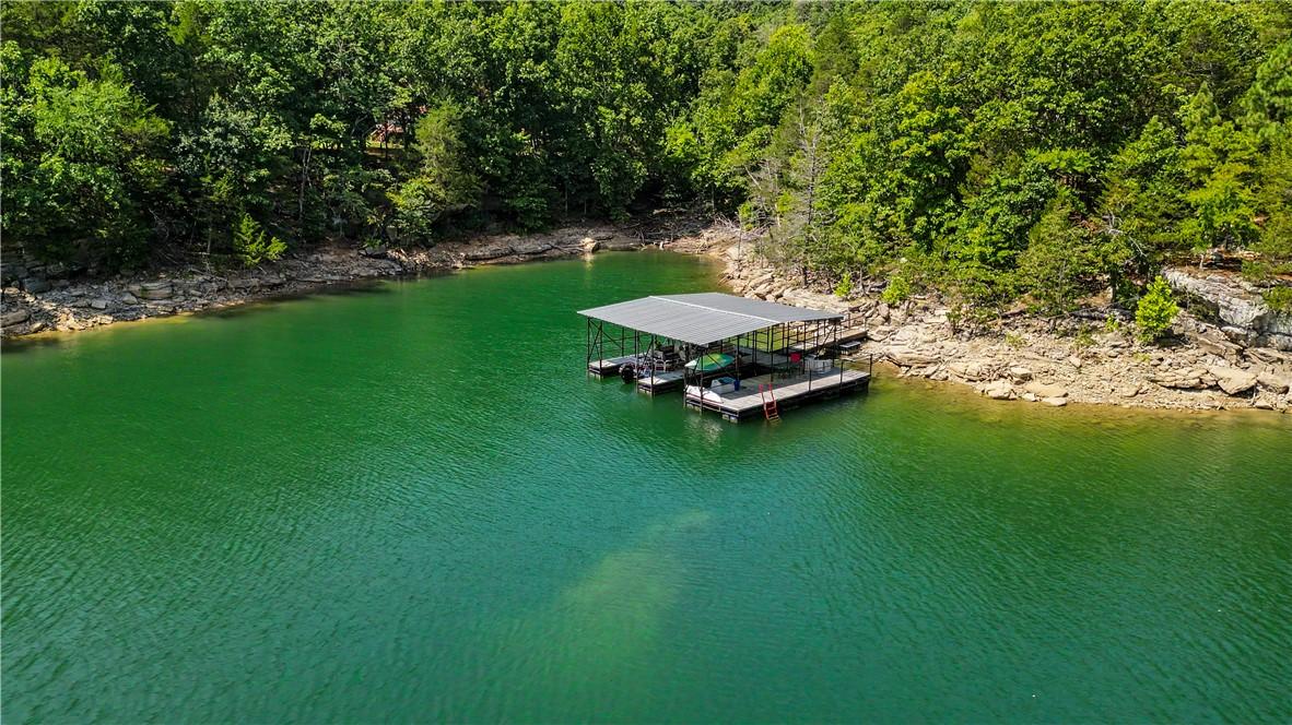 Image 4: Private covered boat dock with two slips and a woo