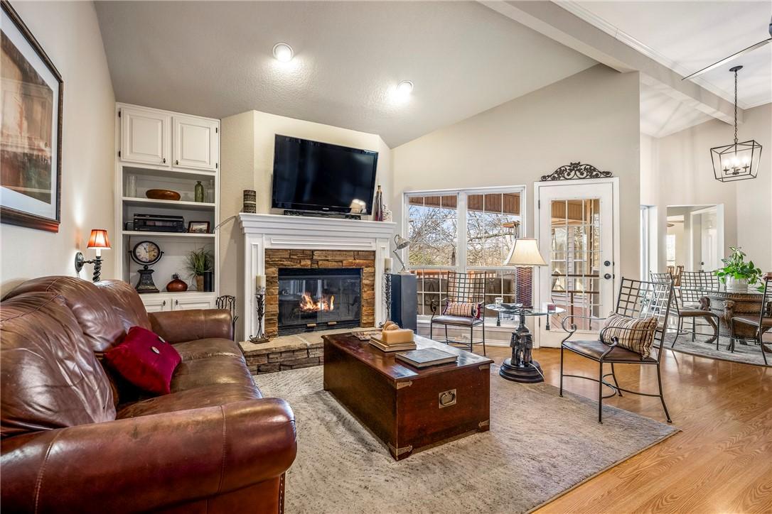 Image 2: Living room featuring light wood-style floors, a s