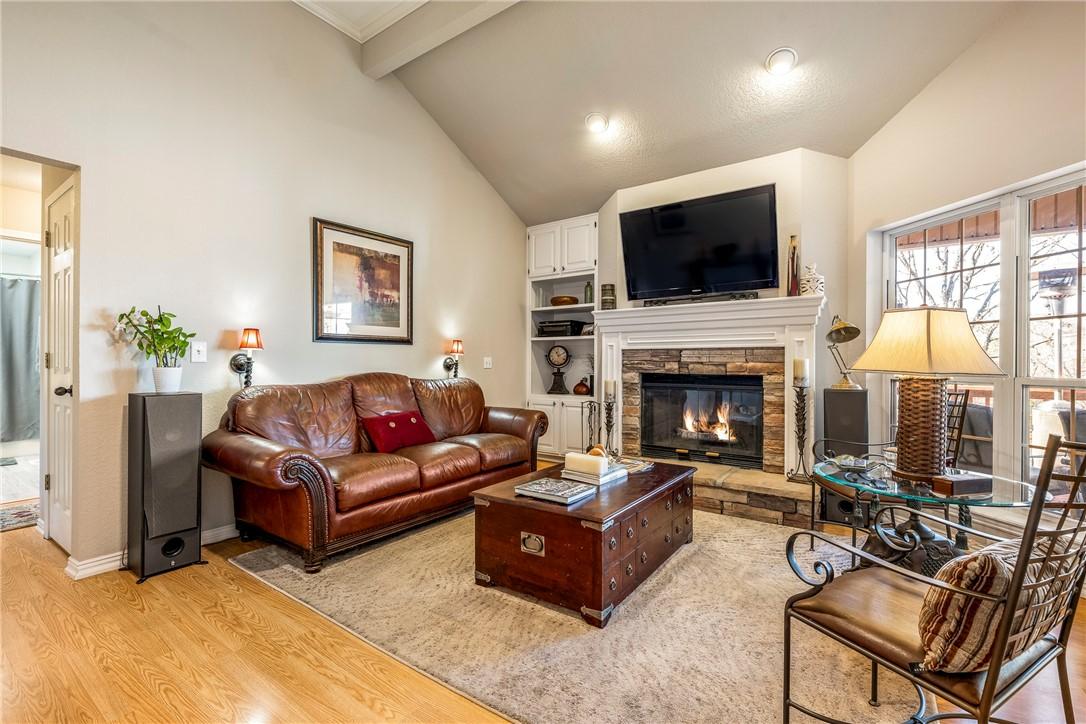 Image 3: Living room with beam ceiling, a fireplace, light