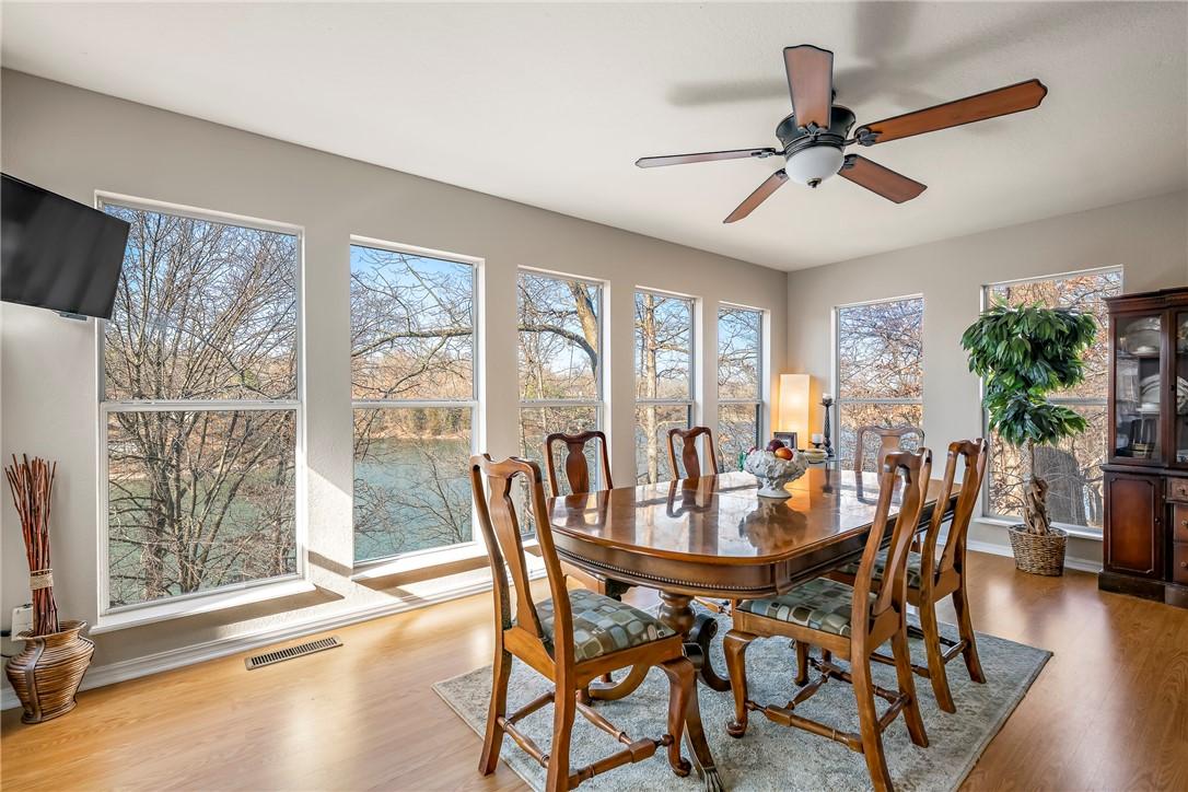 Image 4: Dining space featuring wood finished floors and a