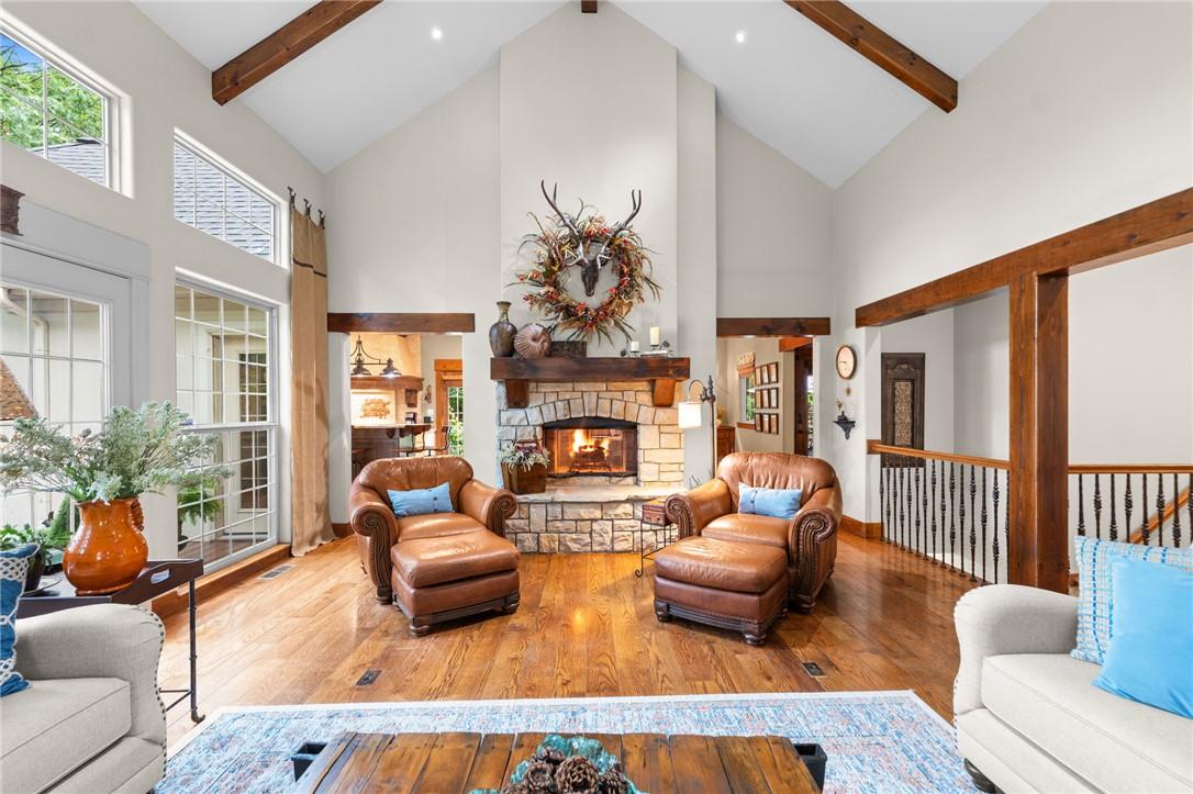Image 4: The wood burning fireplace is a beautiful focal po