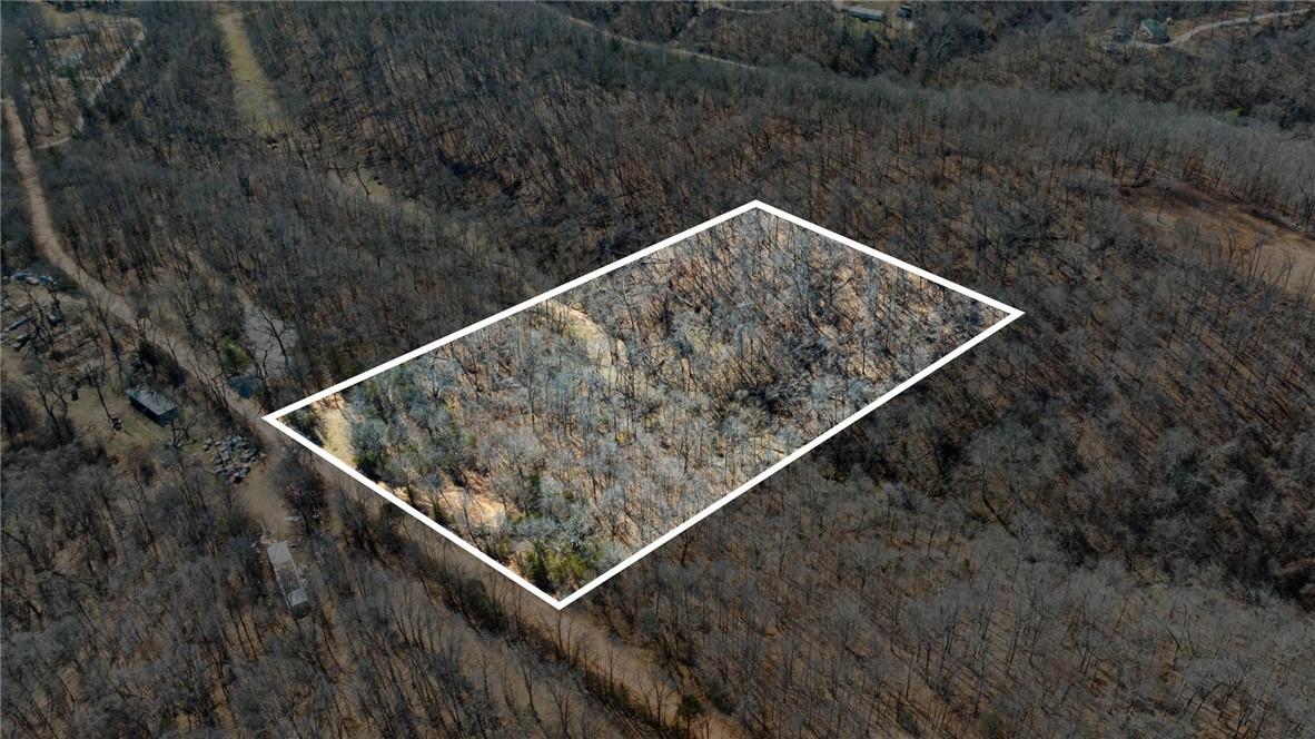 Image 3: Aerial view of property and surrounding area with