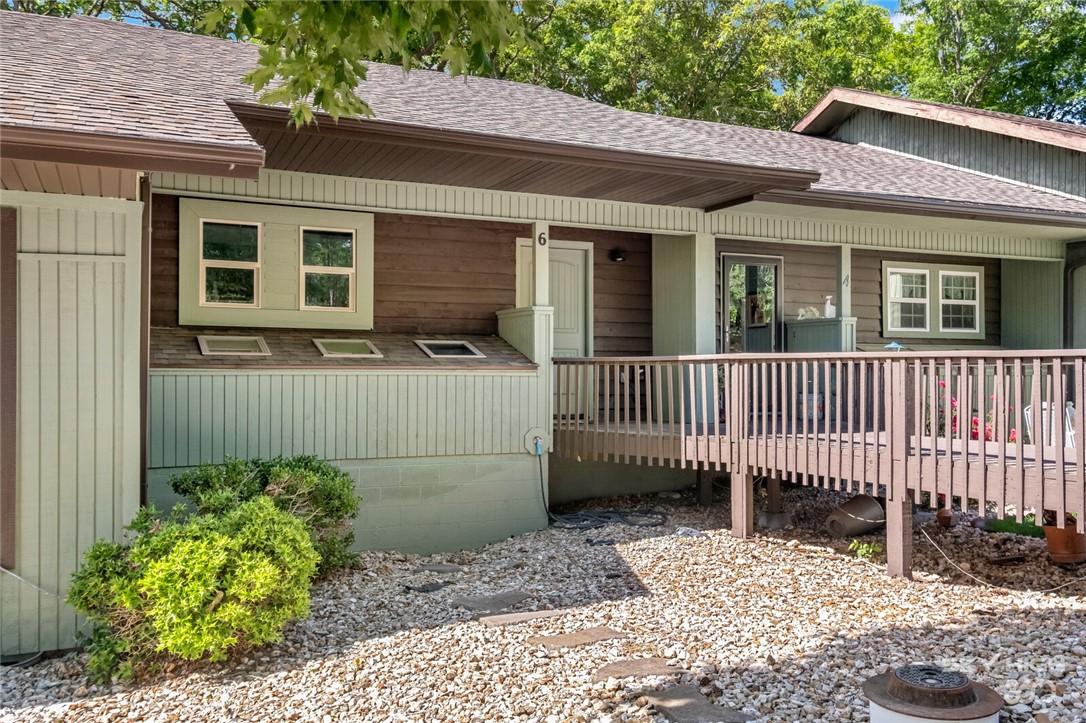 Image 2: View of exterior entry featuring roof with shingle