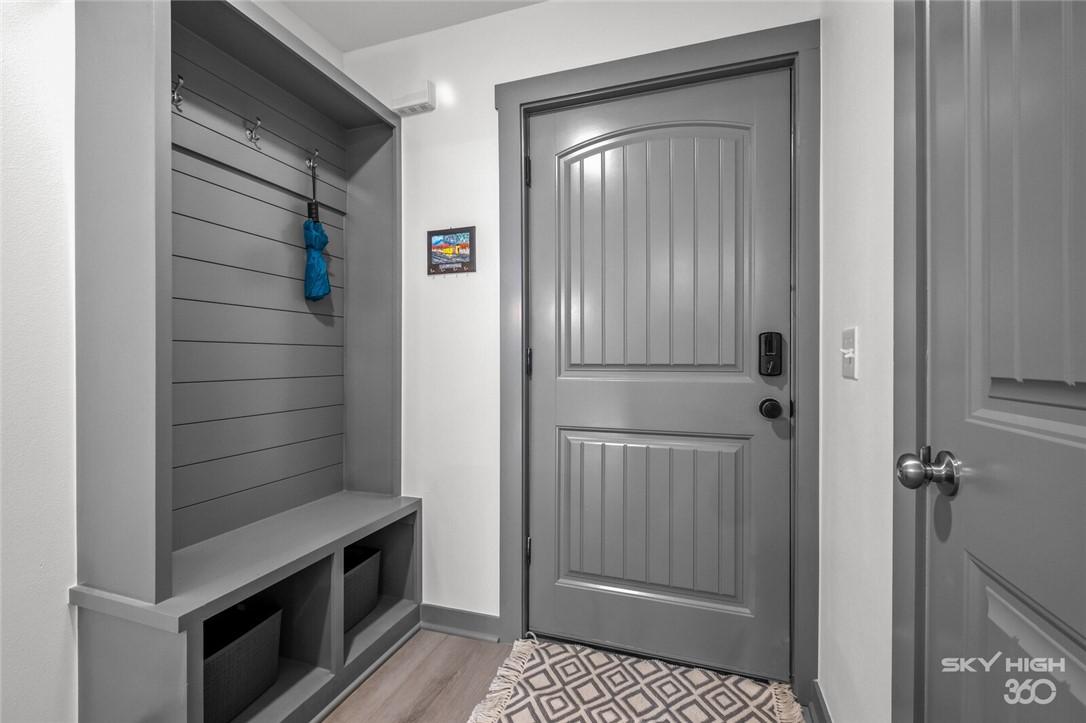 Image 4: Mudroom featuring light wood-type flooring and bas