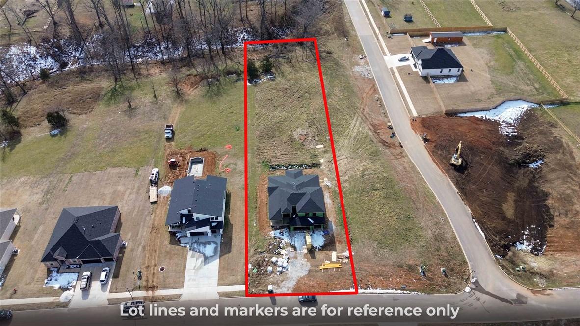 Image 3: Aerial view showcasing a parcel of land with parti