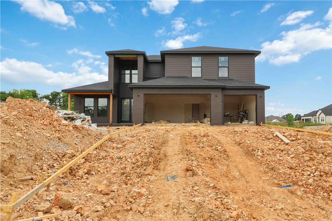 Image 4: New construction residence featuring a dark facade