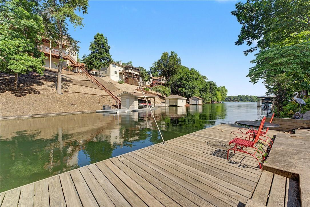 Image 4: Expansive wood dock with concrete platform and acc