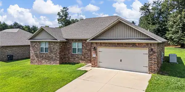 Image 2: Brick exterior with an attached two-car garage