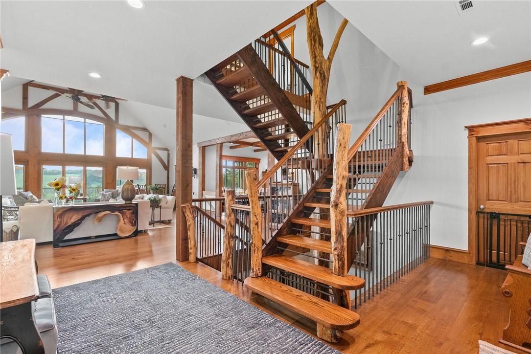 Image 4: Staircase featuring a ceiling fan, wood finished f