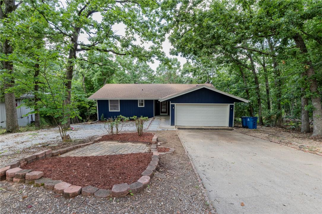 Image 2: Ranch-style residence featuring a dark blue exteri