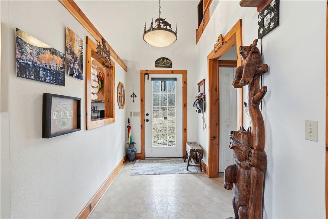 Image 4: Entry hall and a side doorway to the laundry room,