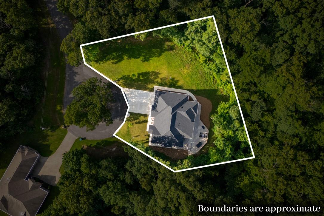 Image 3: Aerial view highlighting a private lot with mature
