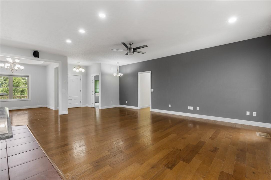 Image 4: Expansive interior featuring wood-finish flooring,