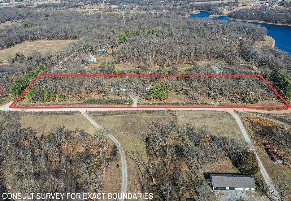 Image 4: Aerial view of property and surrounding area with