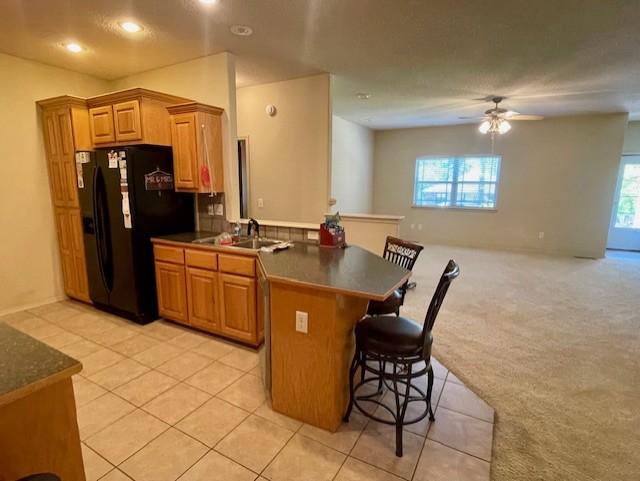 Image 4: Kitchen featuring wood cabinetry, a built-in black