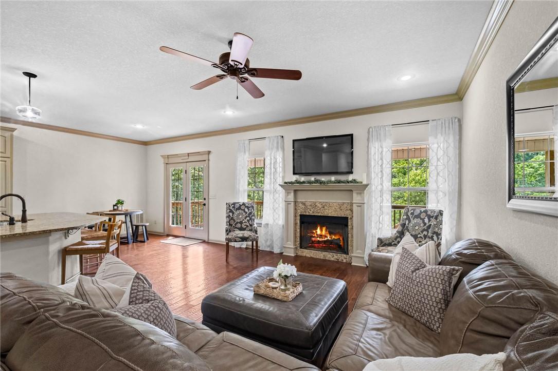 Image 2: Open-concept living space featuring wood-finish fl