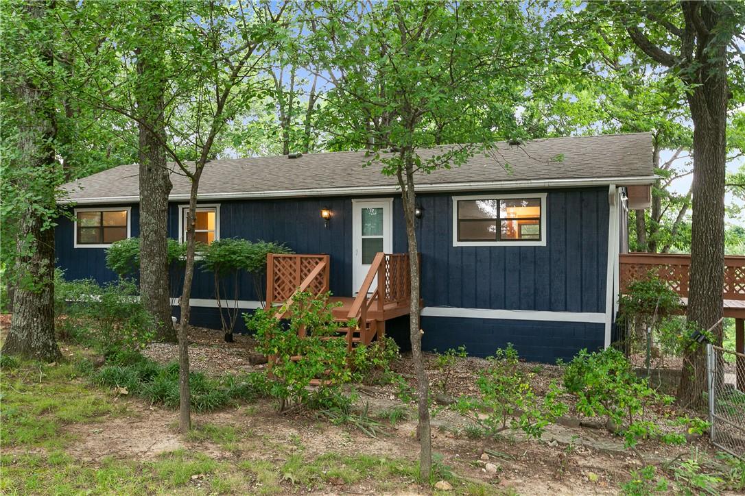 Image 4: Blue vertical siding exterior featuring a contrast
