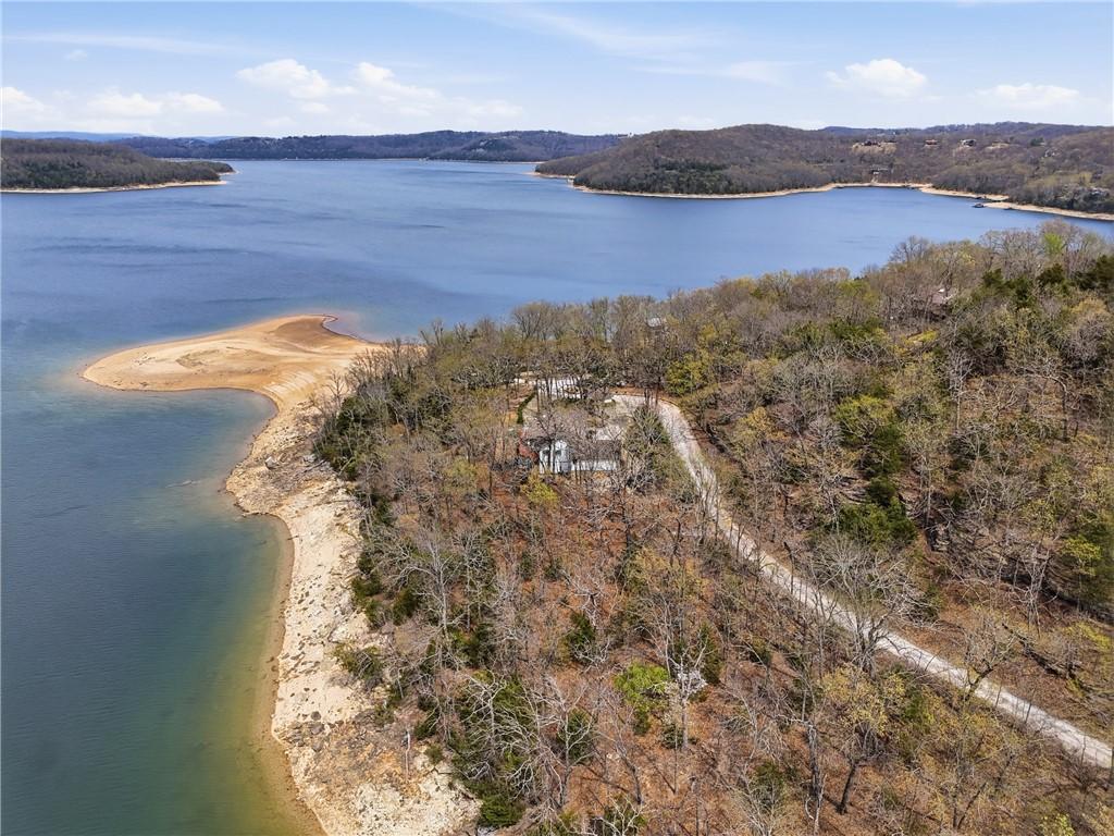 Image 3: Wooded property featuring a private drive and a na
