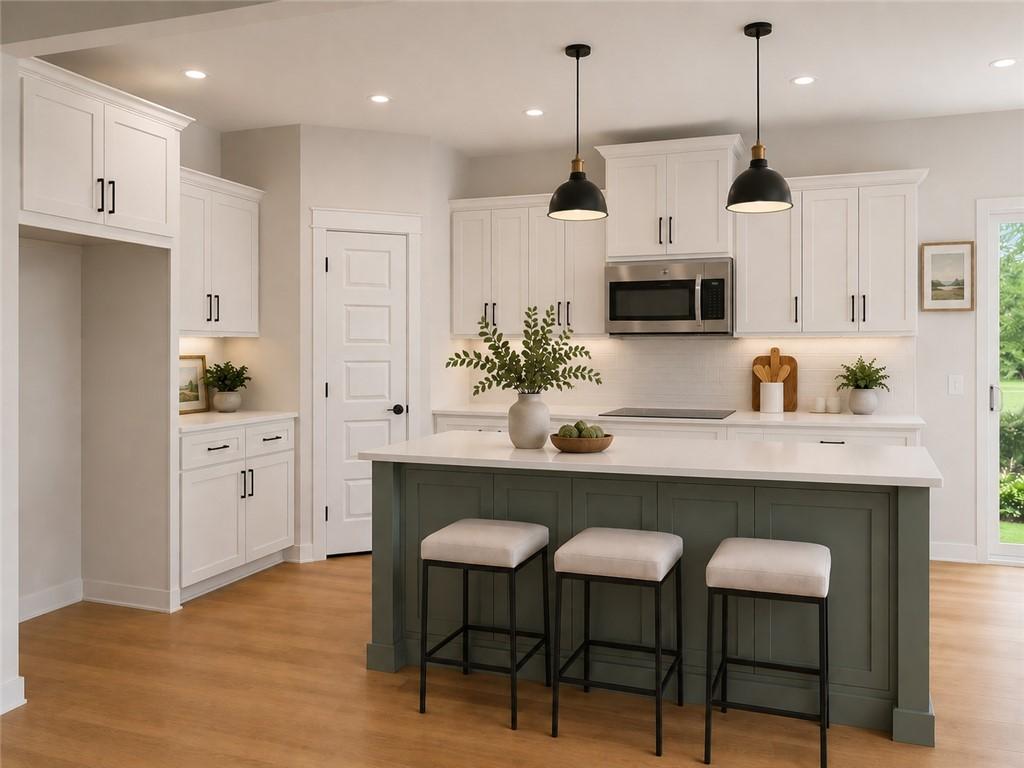 Image 2: Kitchen featuring white shaker-style cabinetry, Cr