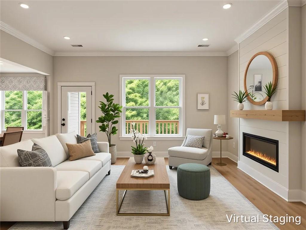 Image 3: Living area featuring an electric fireplace, shipl