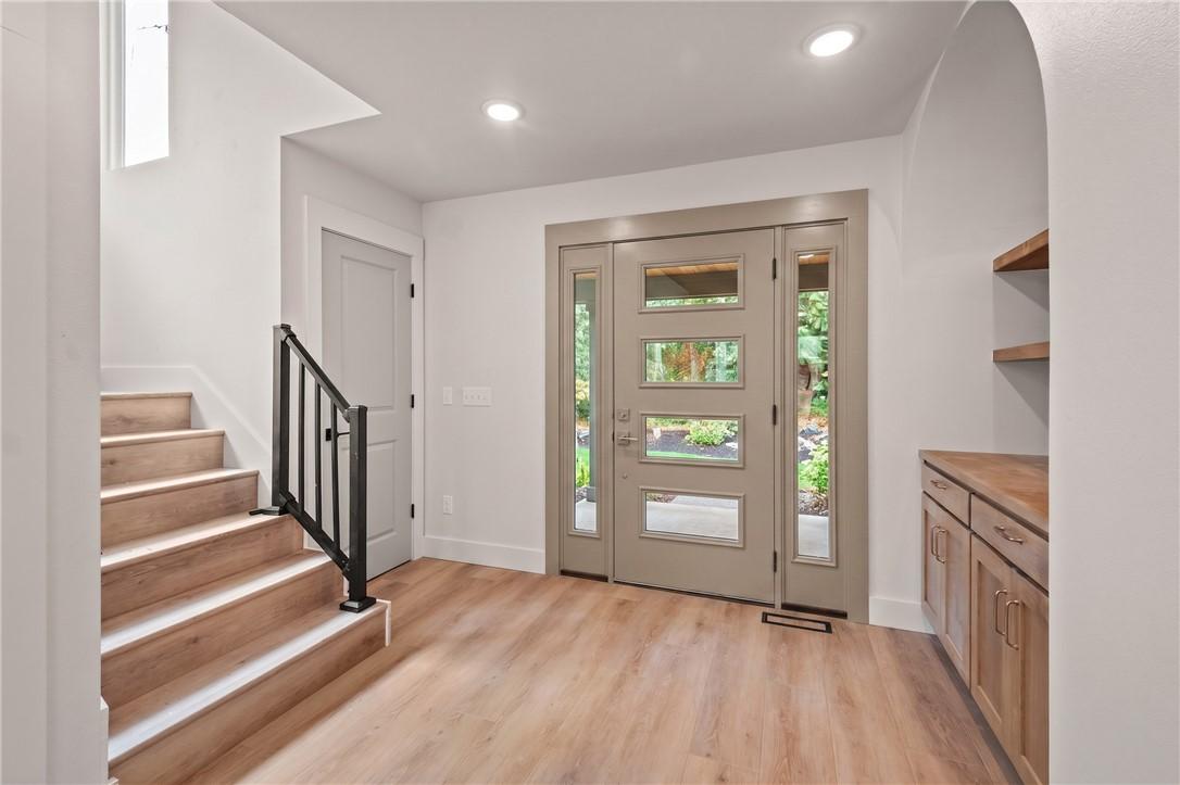 Image 3: Entryway featuring a contemporary front door with