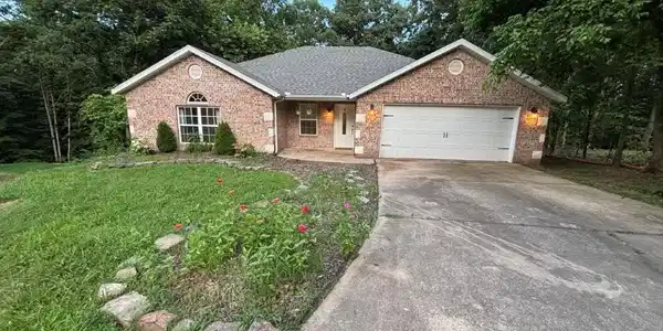 Image 2: Single story home featuring driveway, a front lawn