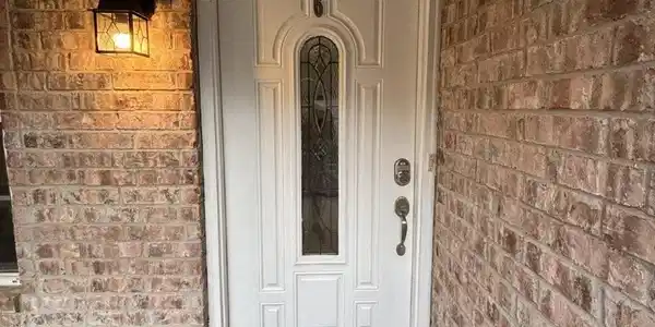 Image 3: Entrance to property with brick siding
