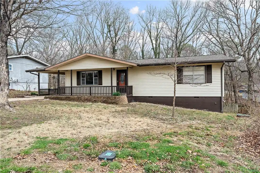 Image 1: Single story home featuring a porch and crawl spac