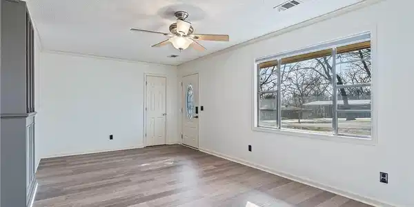 Image 2: Entryway with a ceiling fan, light wood-style floo