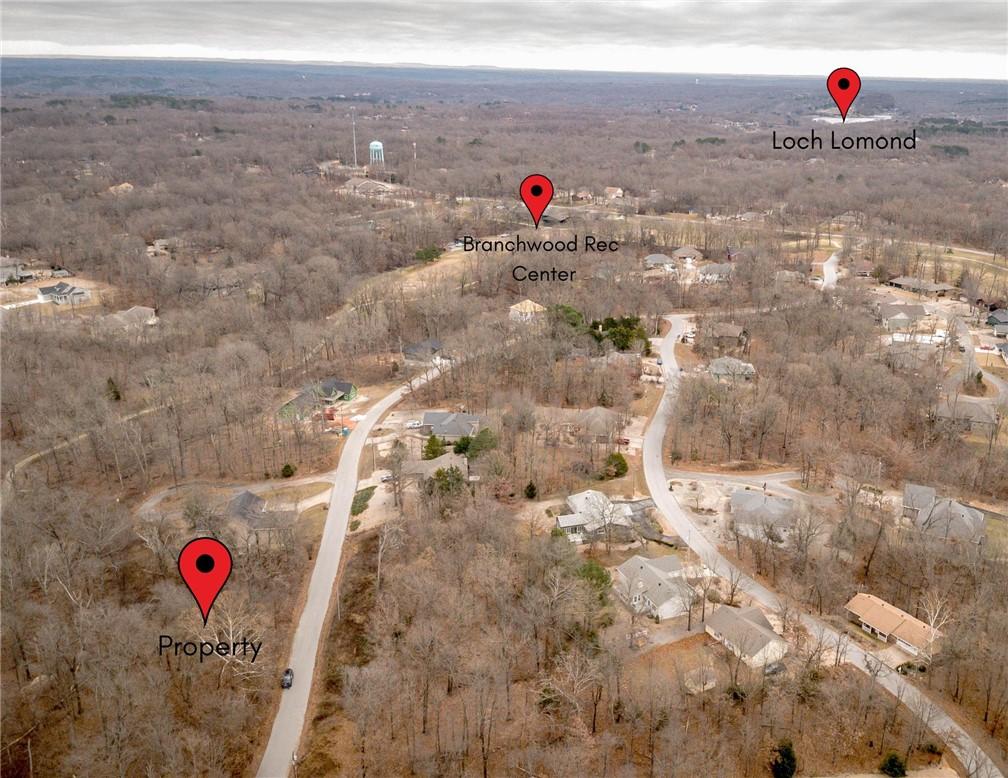 Image 1: Aerial view of property's location with a forest