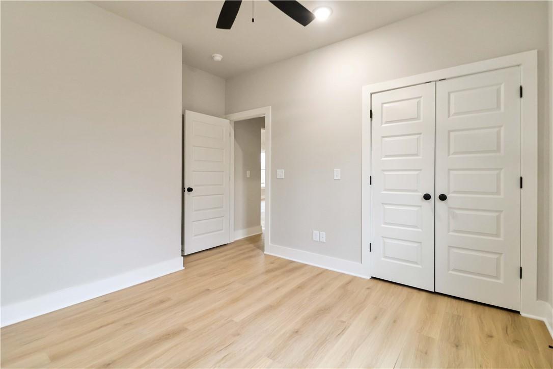 Image 3: Unfurnished bedroom with light wood finished floor