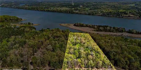 Image 4: Aerial overview of property's location with a heav