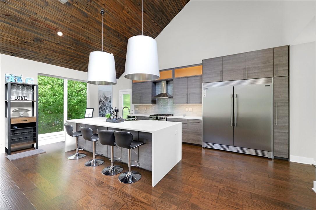 Image 3: Vaulted wood-plank ceiling complementing wide-plan