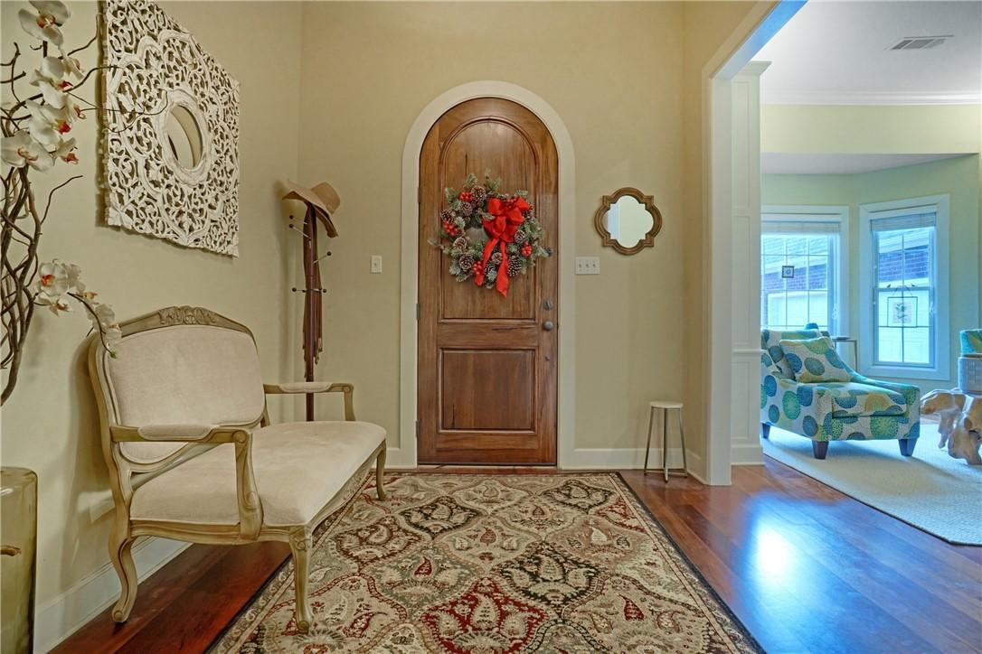 Image 4: Foyer entrance with wood finished floors and crown