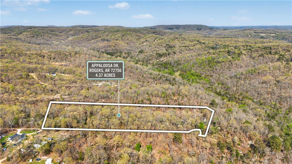 Image 1: Aerial view of property and surrounding area with