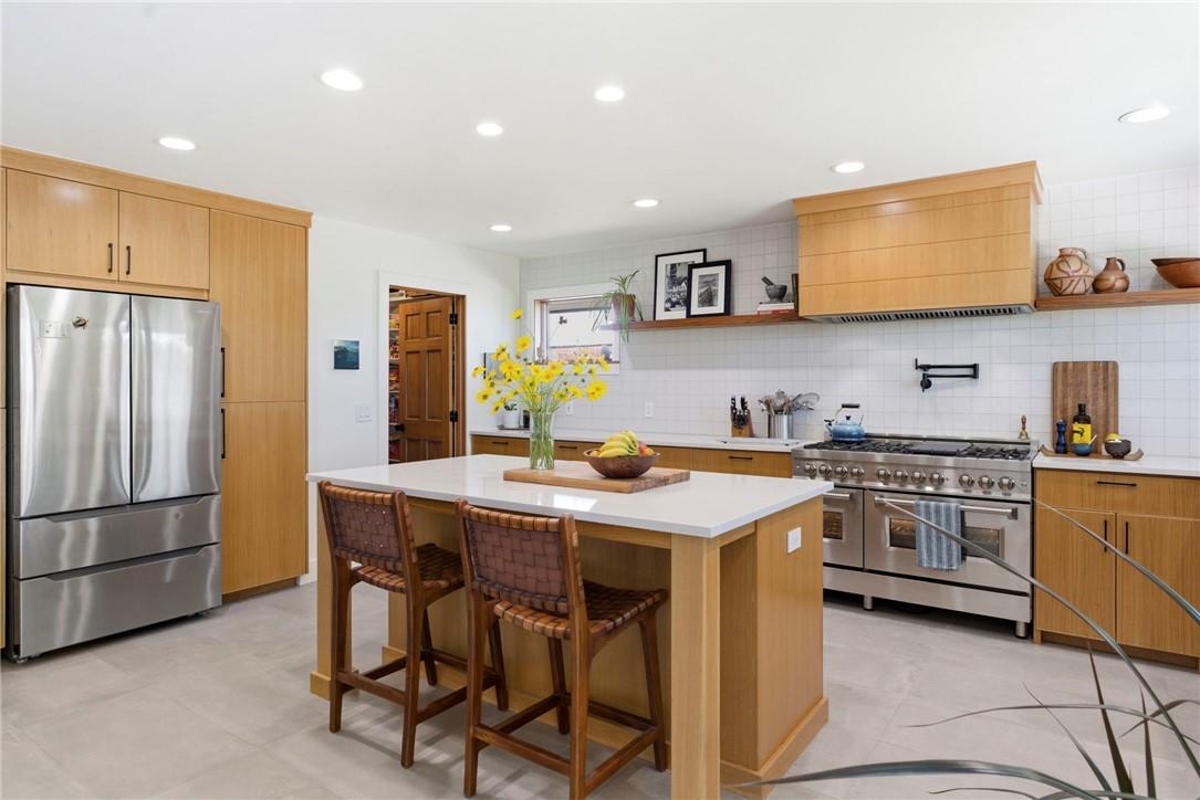 Image 4: Kitchen featuring a central island with countertop