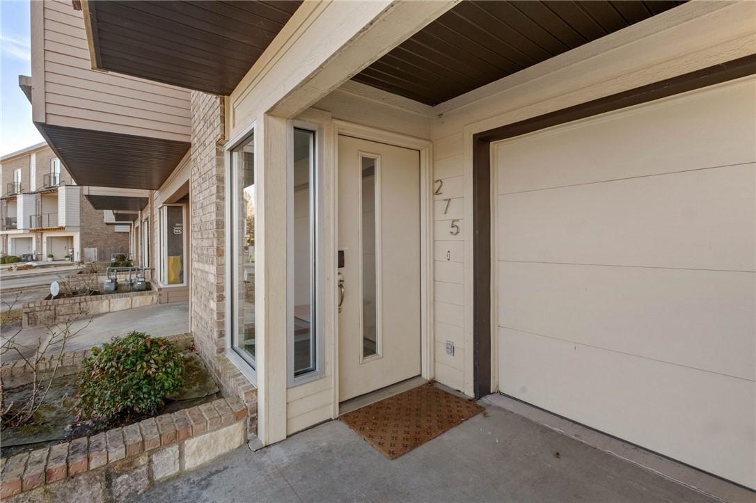 Image 3: View of exterior entry with a patio and a garage
