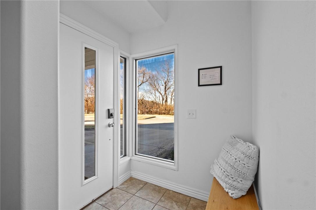 Image 4: Entryway featuring tile patterned floors