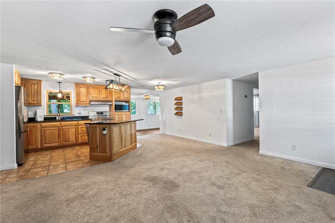 Image 2: View to kitchen from living room.