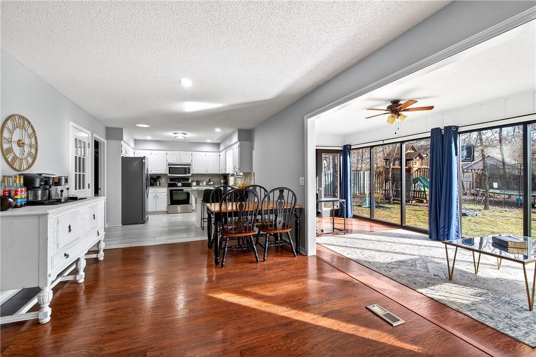 Image 3: Sunroom located off of the kitchen and dining area