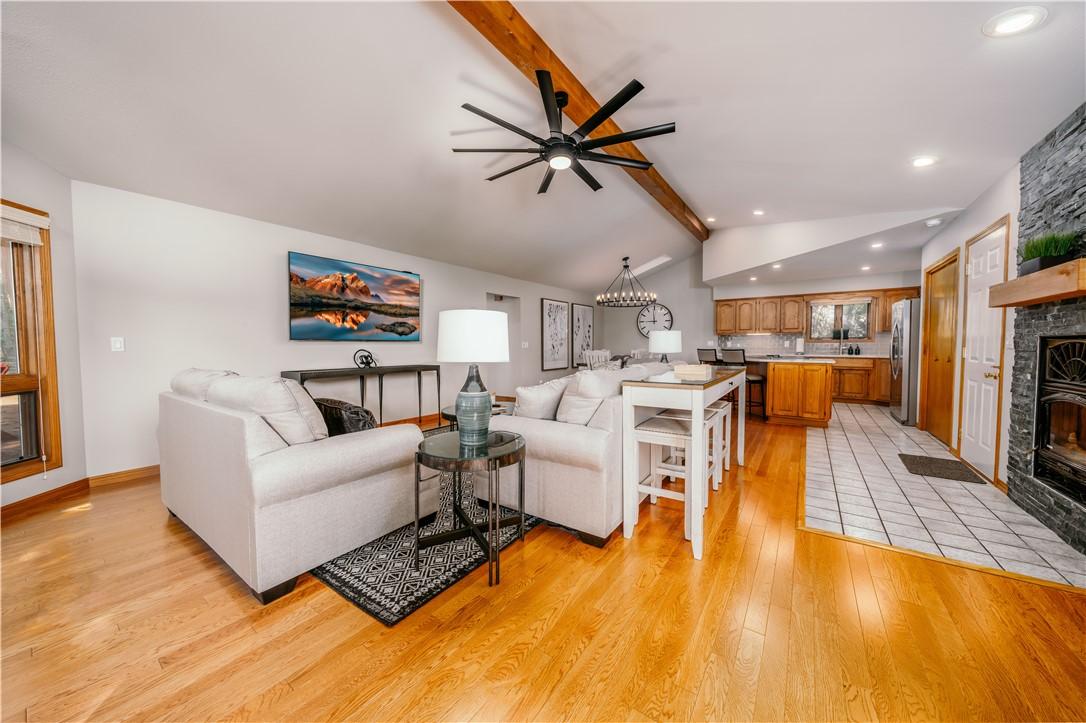 Image 2: Spacious living room with tall ceilings complete w